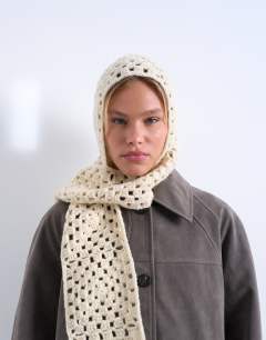 Model wearing Crochet balaclava in cream