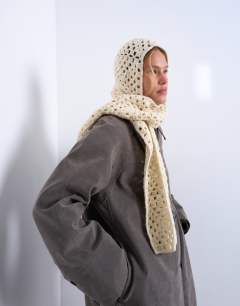 Model wearing Crochet balaclava in cream