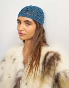Model wearing Crochet beanie hat in deep blue