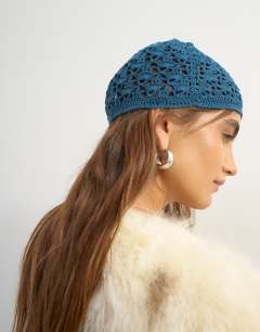 Model wearing Crochet beanie hat in deep blue