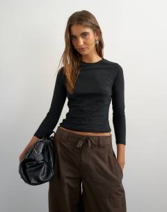 Model wearing Crop sleeve clean raglan top in black