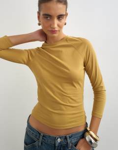 Model wearing Crop sleeve clean raglan top in ochre