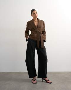 Model wearing Cropped belted boxy blazer in chocolate