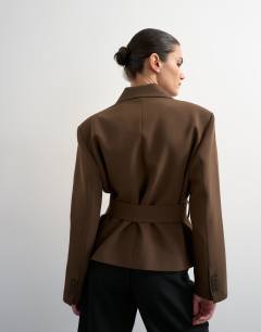 Model wearing Cropped belted boxy blazer in chocolate