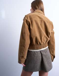 Model wearing Cropped faux suede bomber jacket with popper details in camel
