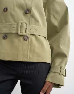 Model wearing Cropped funnel neck trench in khaki
