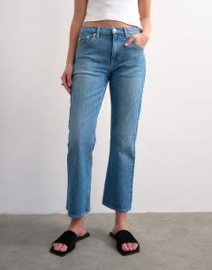 Model wearing Cropped kick flare in mid blue