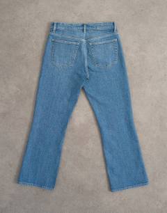 Model wearing Cropped kick flare in mid blue