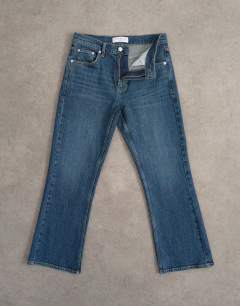 Model wearing Cropped kick flare jean in rich blue