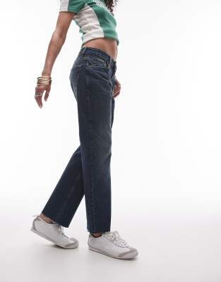 cropped mid rise straight jeans with raw hems in filthy rich blue