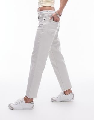 cropped mid rise straight jeans with raw hems in off white