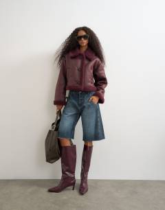 Model wearing Cropped shearling jacket in burgundy