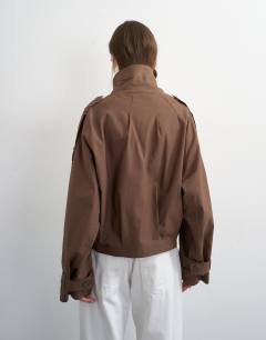 Model wearing Cropped trench in brown