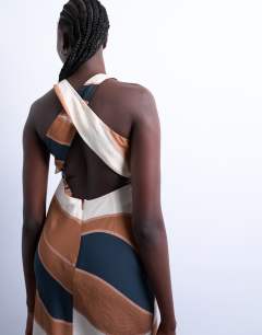 Model wearing Cross back midi cupro dress in boutique stripe