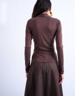 Model wearing Cross over wrap long sleeve top in chocolate brown