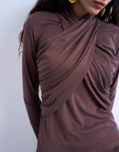 Model wearing Cross over wrap long sleeve top in chocolate brown