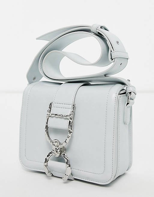 Topshop crossbody bag with hammered metal piece in pale blue