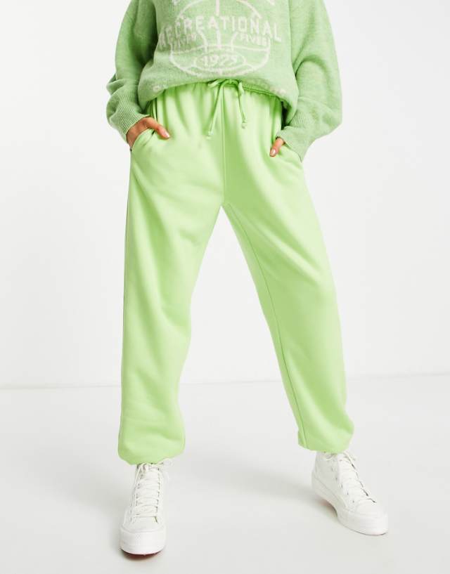 Topshop cuffed oversized sweats in bright green