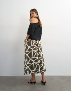 Model wearing Culotte in green abstract