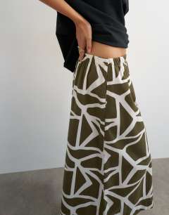 Model wearing Culotte in green abstract