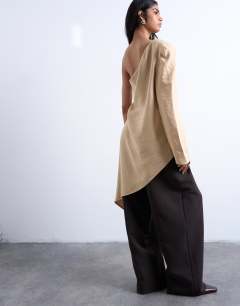 Model wearing Cupro asymmetric top with shoulder pads in stone