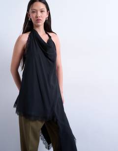 Model wearing Cupro asymmetrical lace halter top in black