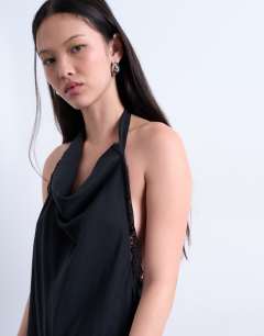 Model wearing Cupro asymmetrical lace halter top in black