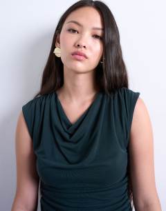 Model wearing Cupro cowl draped top in dark green