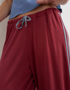 Model wearing Cupro cropped sporty jogger in red