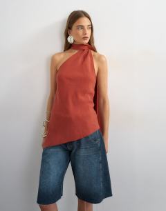 Model wearing Cupro halter scarf detail top in rust