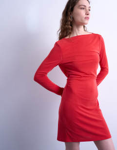 Model wearing Cupro long sleeve cowl back mini dress in red