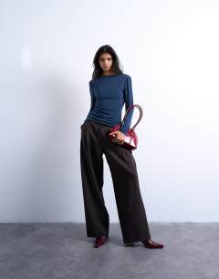 Model wearing Cupro long sleeve cowl back top in navy