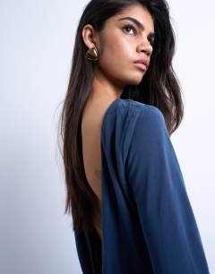 Model wearing Cupro long sleeve cowl back top in navy