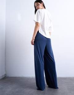 Model wearing Cupro pull on wide leg trousers in navy