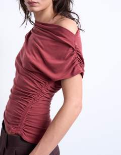 Model wearing Cupro ruched detail top in rust red