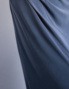 Model wearing Cupro twist detail maxi skirt co-ord in charcoal grey