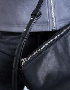 Model wearing Curly scoop shoulder bag in black