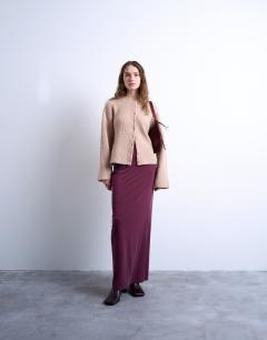 Model wearing Curpo ruched maxi skirt with hitch side detail in burgundy