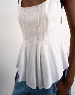 Model wearing Curve hem linen top in ivory