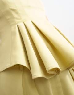 Model wearing Curve hem tailored top in buttermilk