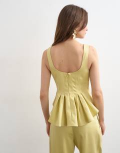 Model wearing Curve hem tailored top in buttermilk