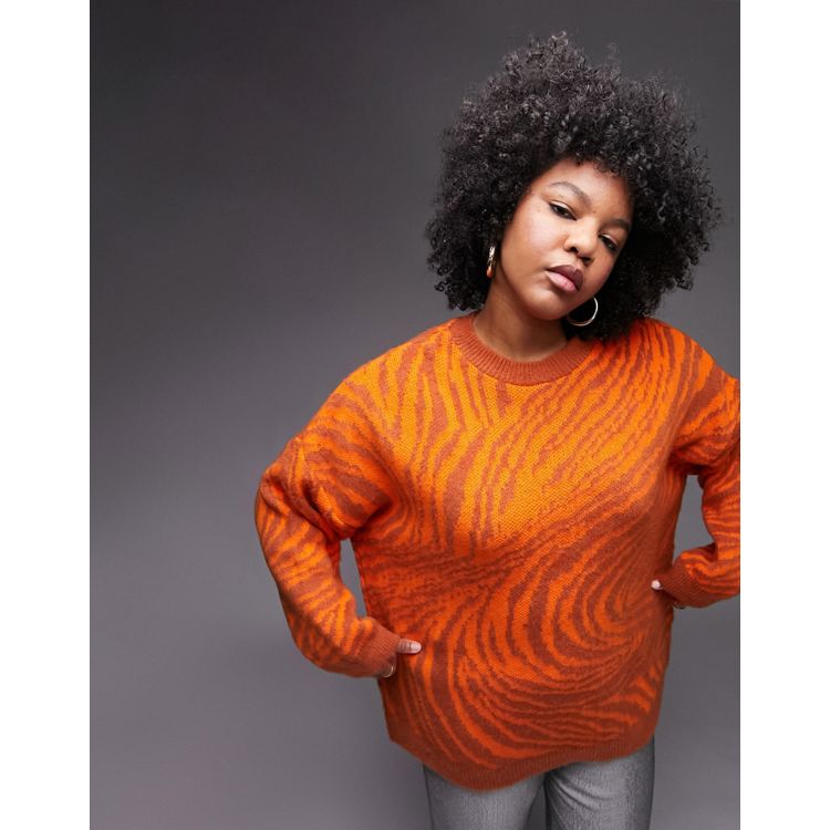 Topshop curve knitted orange zebra print oversized knit jumper. It has an orange tonal Animal print, Crew neck, long sleeves with relaxed dropped shoulders and an Oversized fit. Ribber neck and cuffs. 