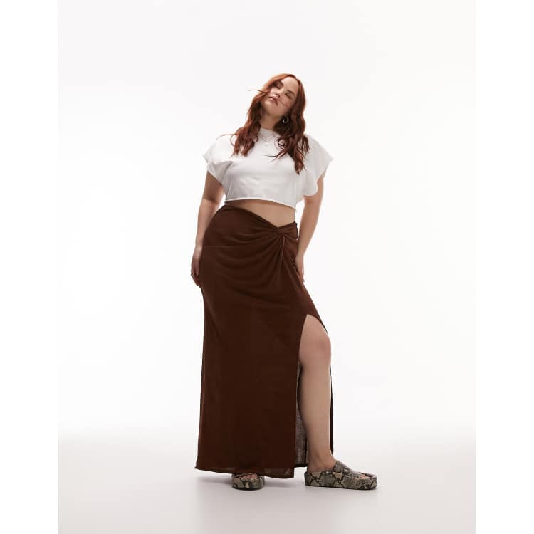 Best high street Maxi skirts. Topshop curve slinky maxi skirt with front split in chocolate brown. Ruched  twist knot detail at the waist. 