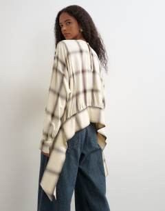 Model wearing Curved hem blouse in neutral check