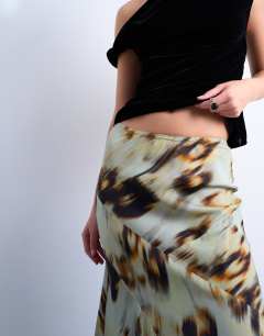 Model wearing Cut about midi skirt in green blur floral