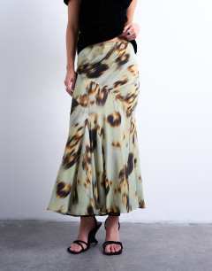 Model wearing Cut about midi skirt in green blur floral
