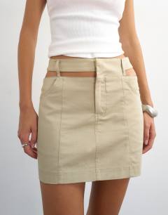 Model wearing Cut away micro mini skirt in stone