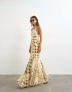 Model wearing Cut away racer neck full skirt maxi dress in taupe and chocolate polka dot