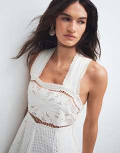 Model wearing Cutwork broderie mixed trapeze maxi dress in white