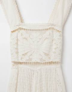 Model wearing Cutwork broderie mixed trapeze maxi dress in white